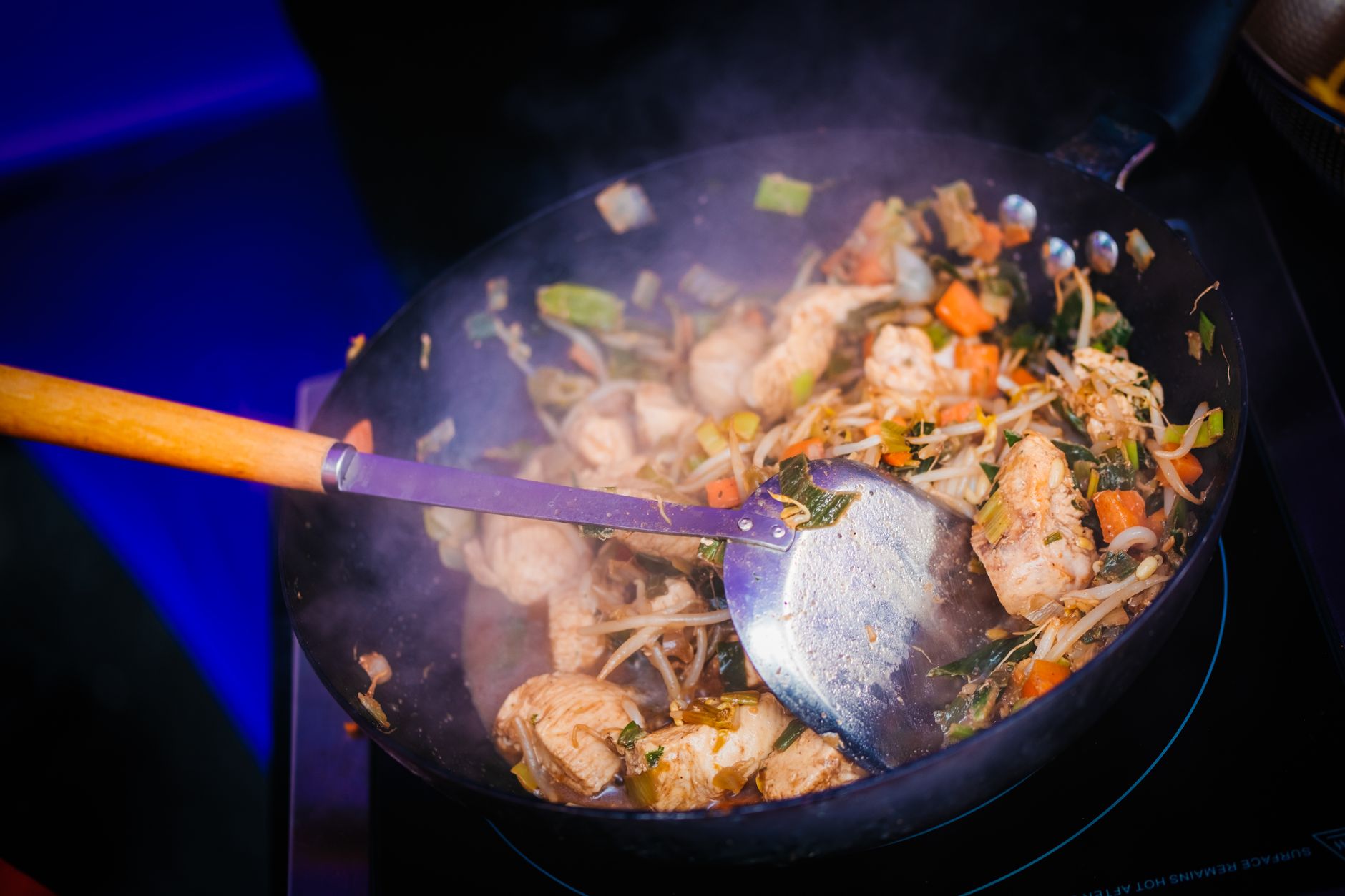 Skillet of garlic-ginger chicken stir-fry with rice
